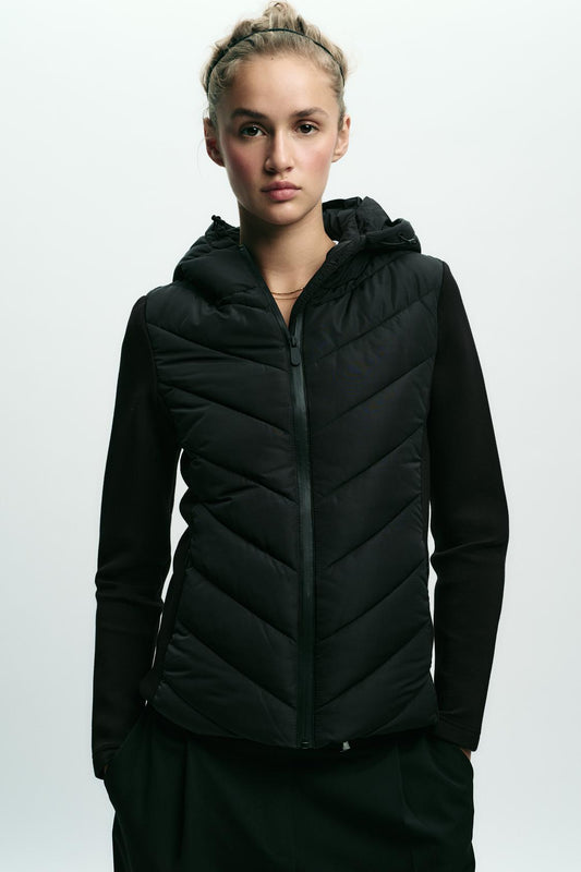 Black Chevron Quilted Hooded Puffer Jacket Stretch Knit Sleeves View 2 | Velvyra Paris