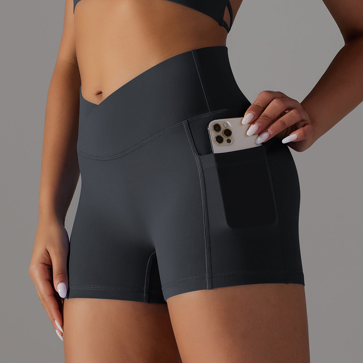 Pantalones cortos de yoga con diseño de bolsillo para teléfono, pantalones deportivos de fitness para mujer.