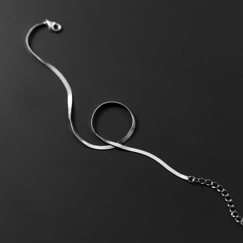 Tobillera de cadena única con diseño de serpiente y hueso plano de plata S925