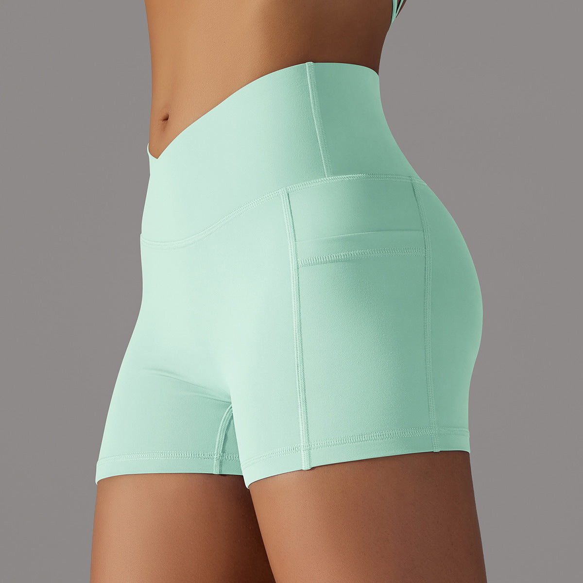 Pantalones cortos de yoga con diseño de bolsillo para teléfono, pantalones deportivos de fitness para mujer.