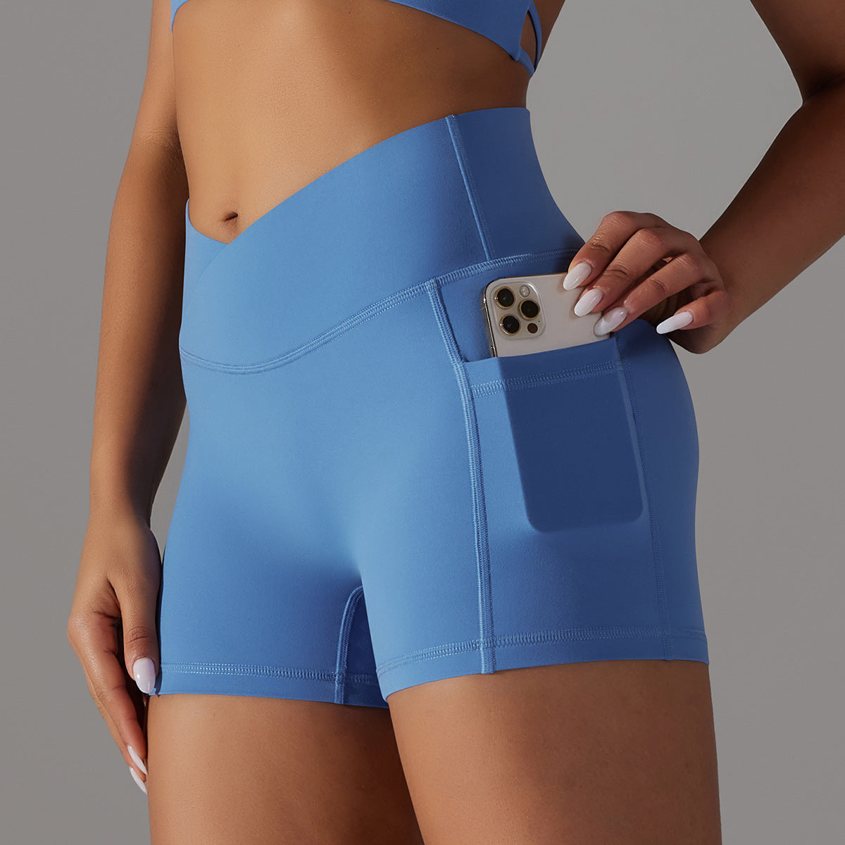 Pantalones cortos de yoga con diseño de bolsillo para teléfono, pantalones deportivos de fitness para mujer.