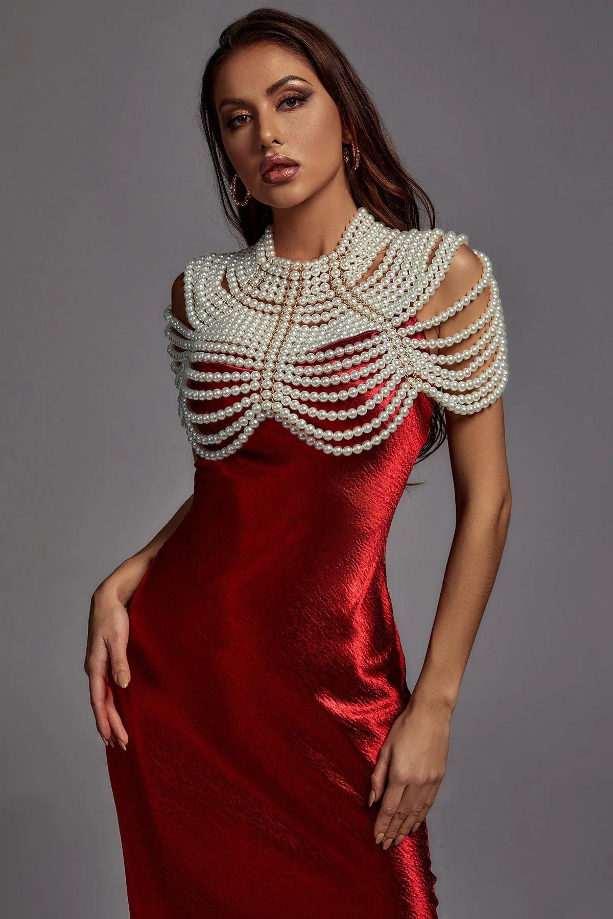 red dress with a white pearl embellished top accessories 